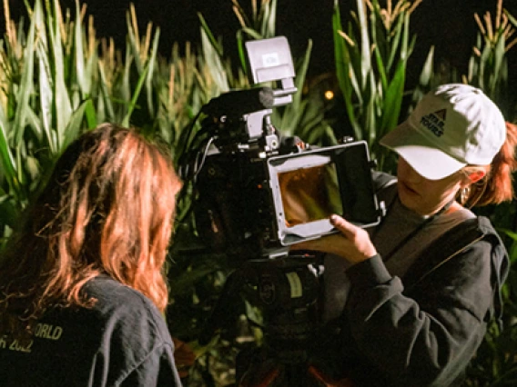 Film students in a field