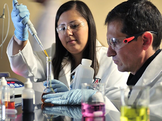 Two students working in a lab