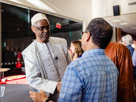 Speaker interacting with attendees during keynote reception