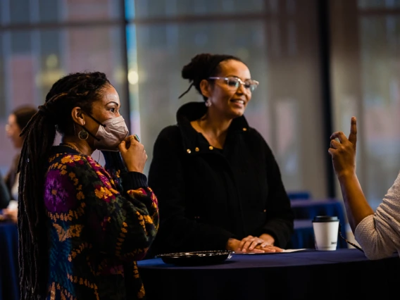 Speaker interacting with attendees during keynote reception