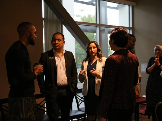 Speaker interacting with guests during keynote reception