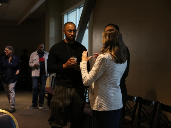 Speaker interacting with guests during keynote reception