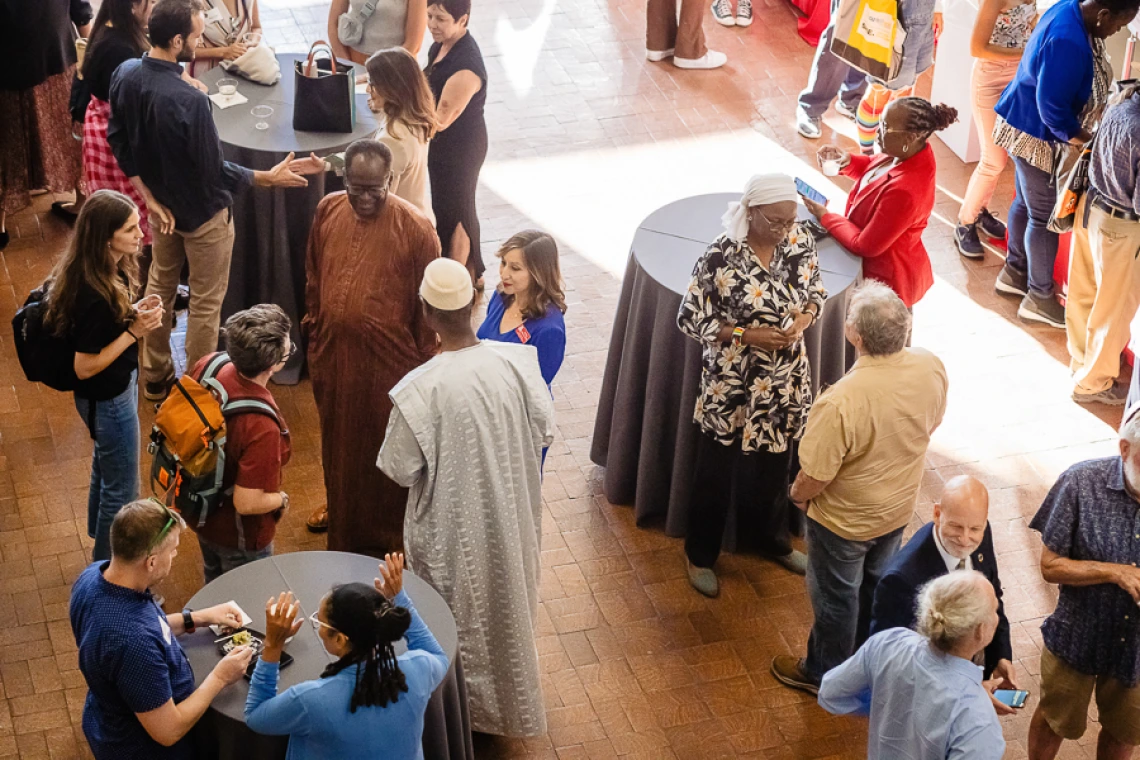 Speaker interacting with attendees during keynote reception