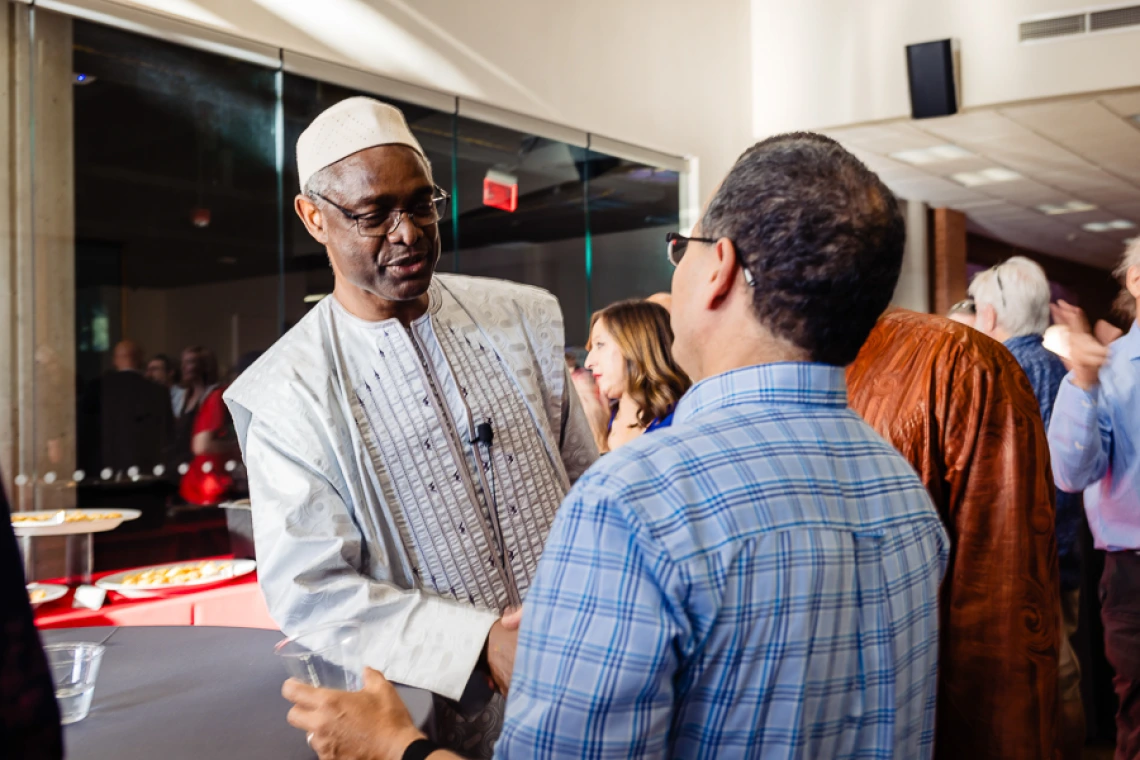 Speaker interacting with attendees during keynote reception