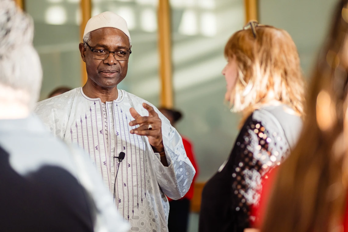 Speaker interacting with attendees during keynote reception