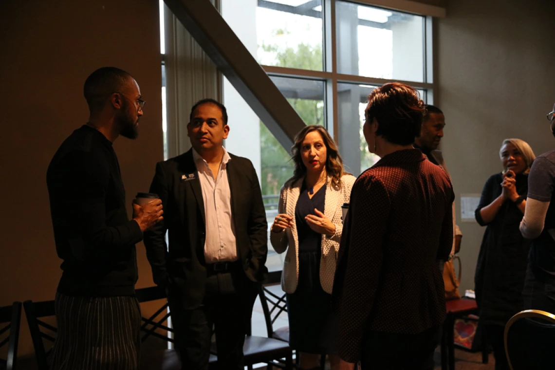 Speaker interacting with guests during keynote reception