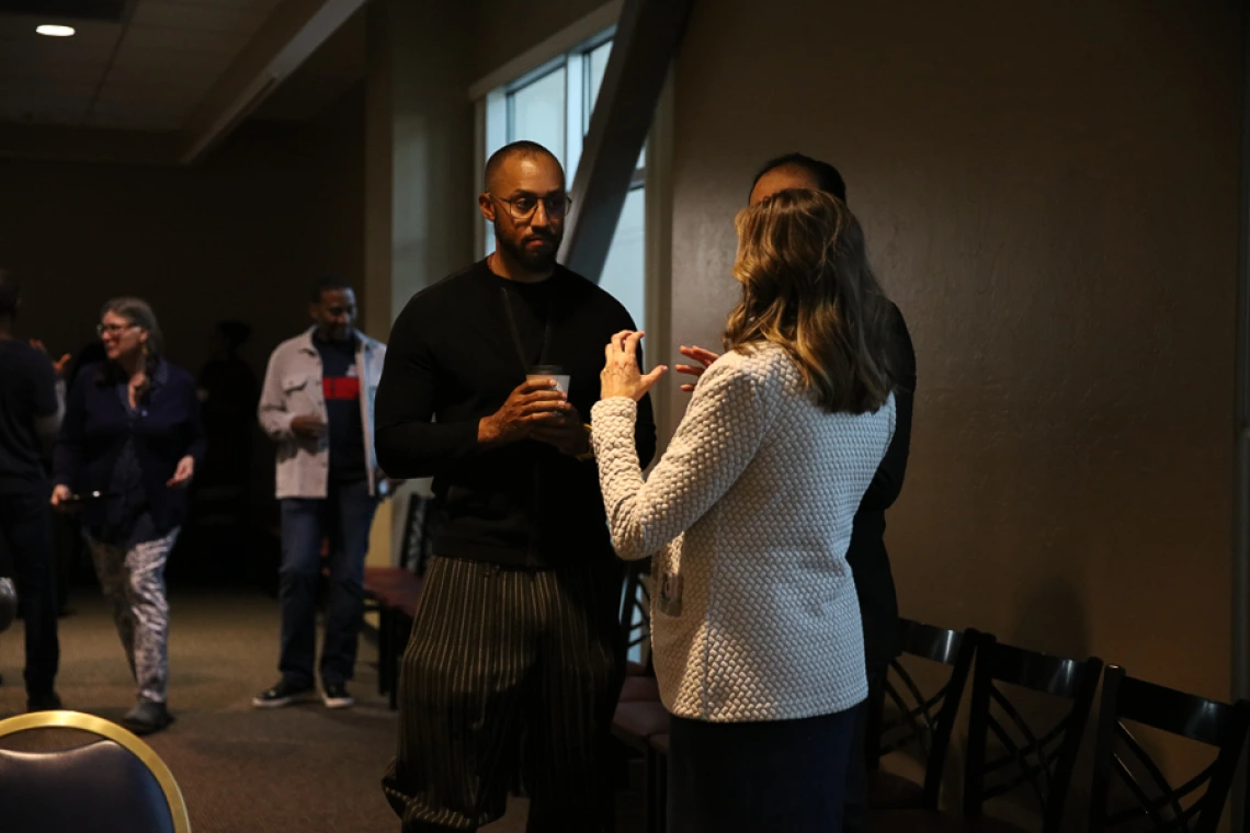 Speaker interacting with guests during keynote reception