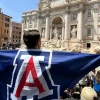 University of Arizona student holds flag with Block A