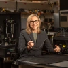 Jennifer Barton in a lab holding an ovarian cancer detection falloposcope