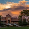old main rising above a bed of flowers